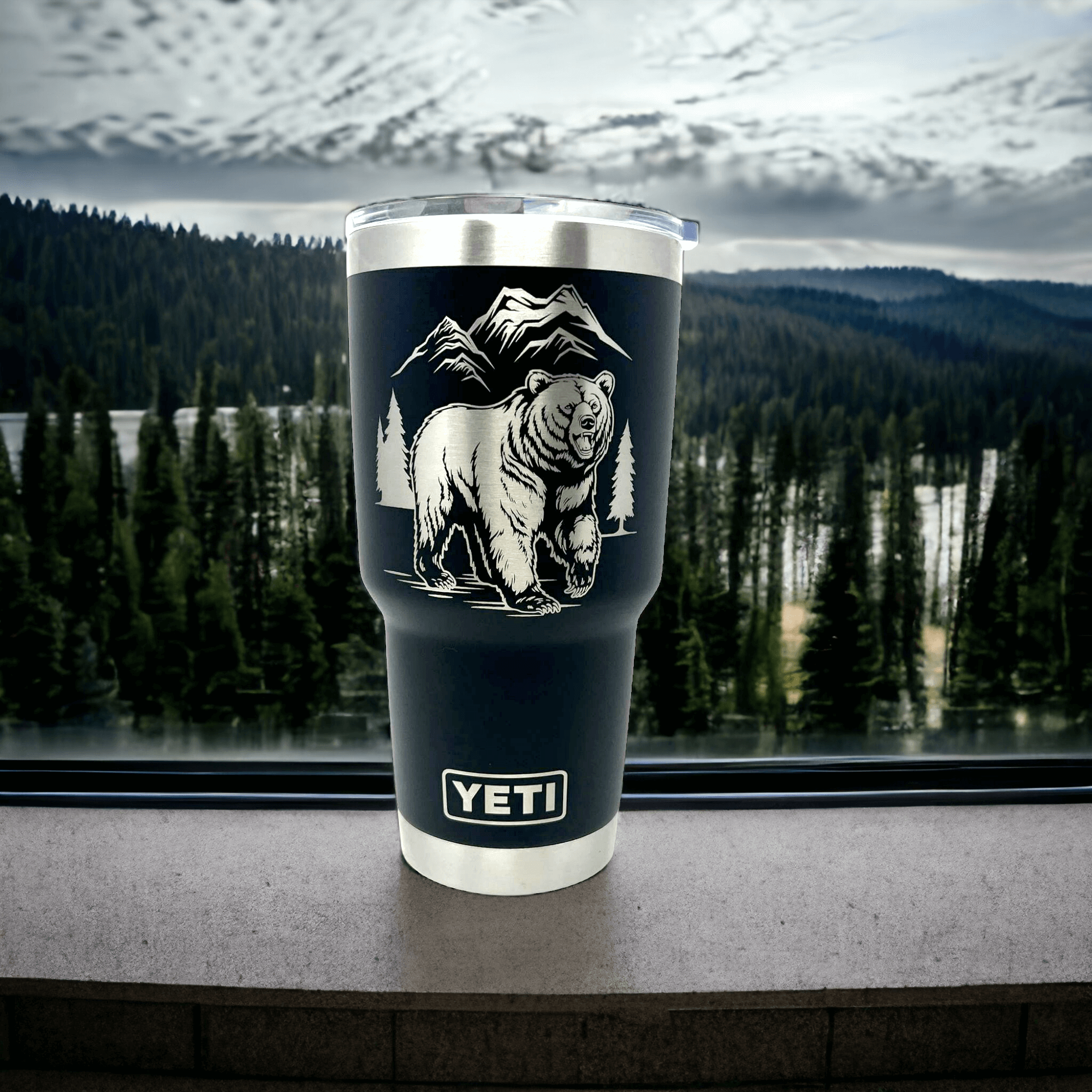 Grizzly Bear artwork laser engraved - silver on black Yeti tumbler with white background in photo