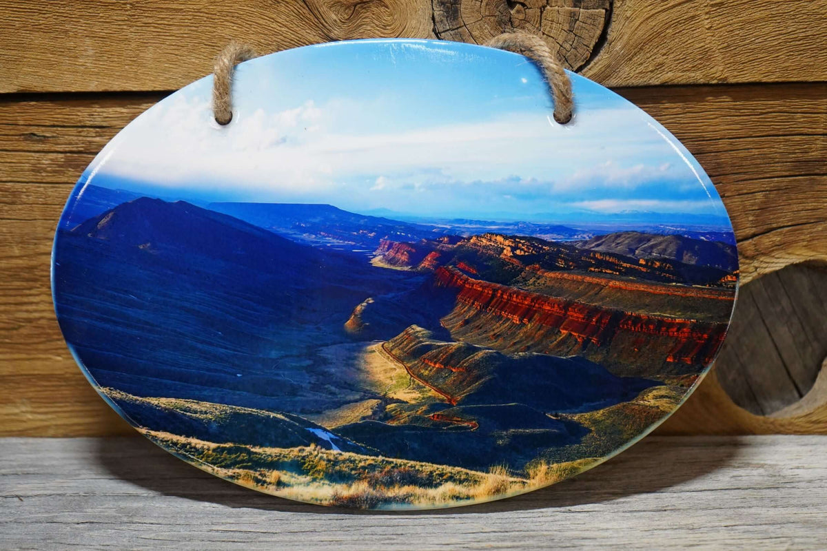 Oval ceramic wall decor featuring photo of Red Canyon outside Lander, Wyoming