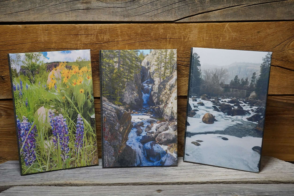 7x9&quot; hardcover journals with Wyoming photos sublimated on cover. Wildflower, Waterfall, or Winter scenes. Photography by Libby Littler.