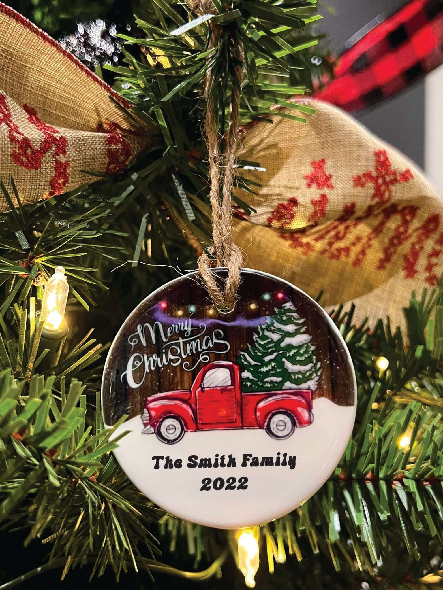 Customizable Red Truck Merry Christmas Ornament hanging on tree