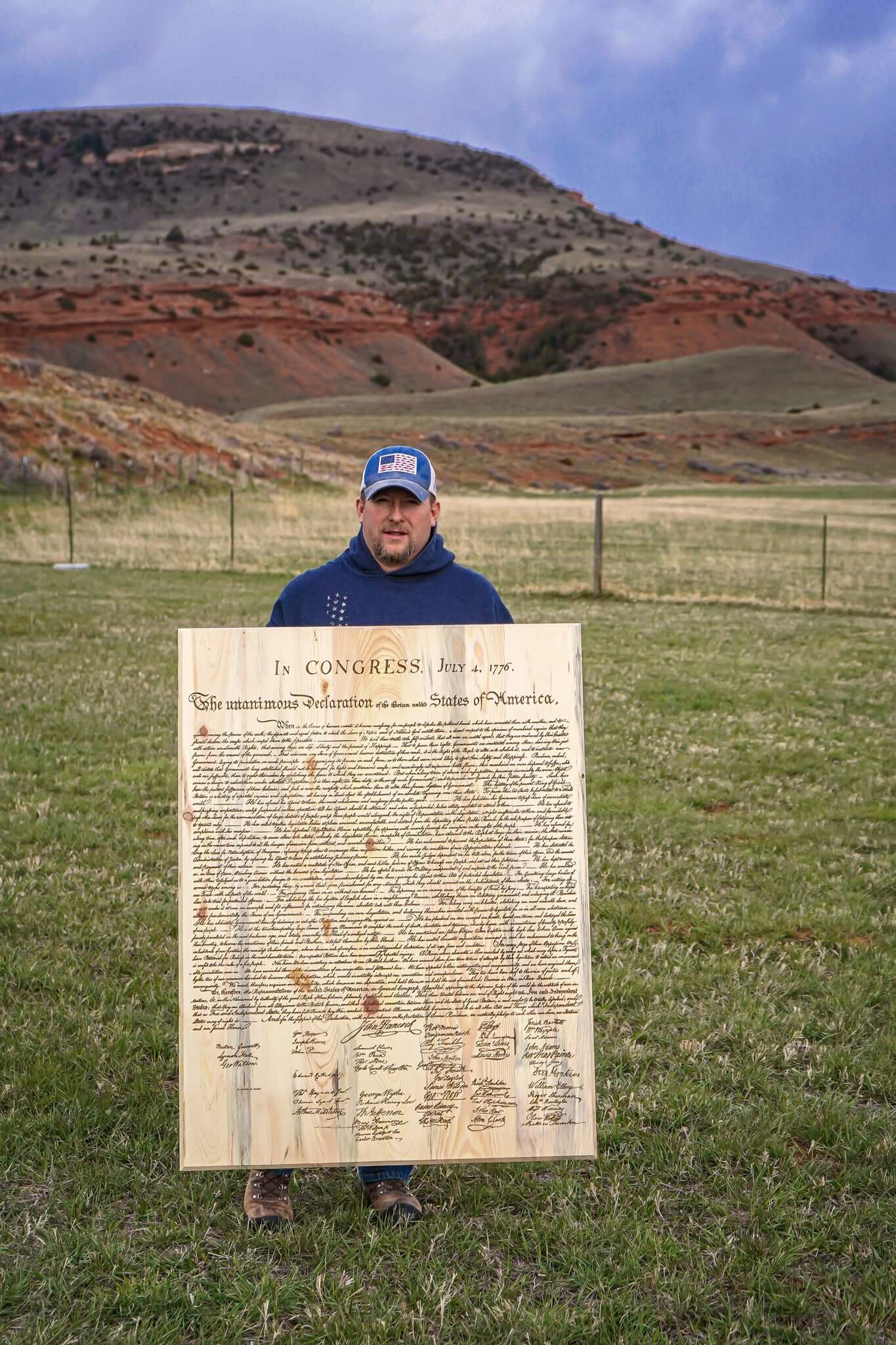 Declaration of Independence laser engraved on pine on display with Wyoming landscape in background